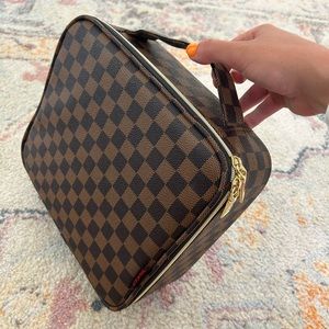 Brown checkered travel case